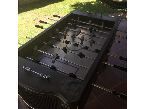 play foosball in the outdoor lounge