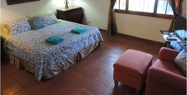 inside of the king-sized bed la jungla experience Private AirBnB Room